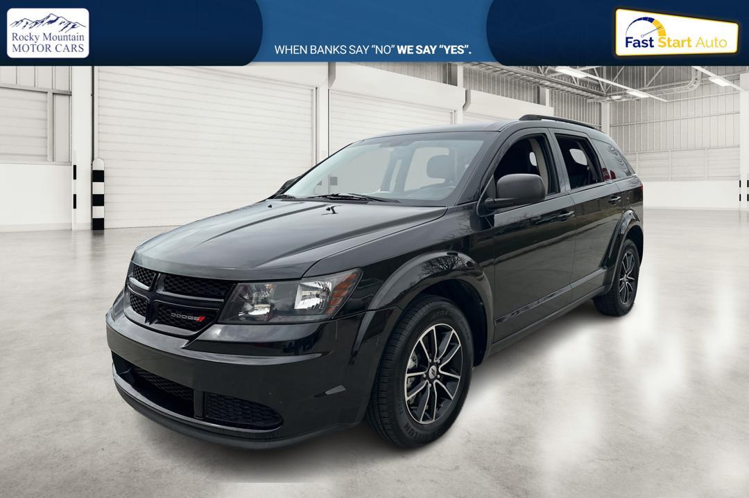 2018 Black Dodge Journey SE (3C4PDCAB6JT) with an 2.4L L4 DOHC 16V engine, 4A transmission, located at 767 S State Road, Pleasant Grove, UT, 84062, (801) 785-1058, 40.354839, -111.736687 - Photo #6