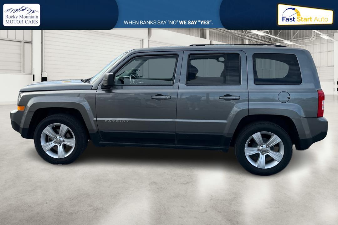 2014 Gray Jeep Patriot Latitude 2WD (1C4NJPFA4ED) with an 2.0L L4 DOHC 16V engine, Automatic, 6-Spd w/AutoStick transmission, located at 7755 State Street, Midvale, UT, 84047, (801) 753-9063, 40.610329, -111.890656 - Photo #5