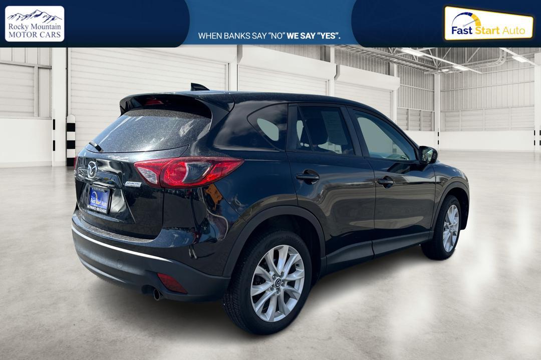 2014 Black Mazda CX-5 Grand Touring AWD (JM3KE4DY8E0) with an 2.5L L4 DOHC 16V engine, 6-Speed Automatic transmission, located at 7755 State Street, Midvale, UT, 84047, (801) 753-9063, 40.610329, -111.892159 - Photo #2