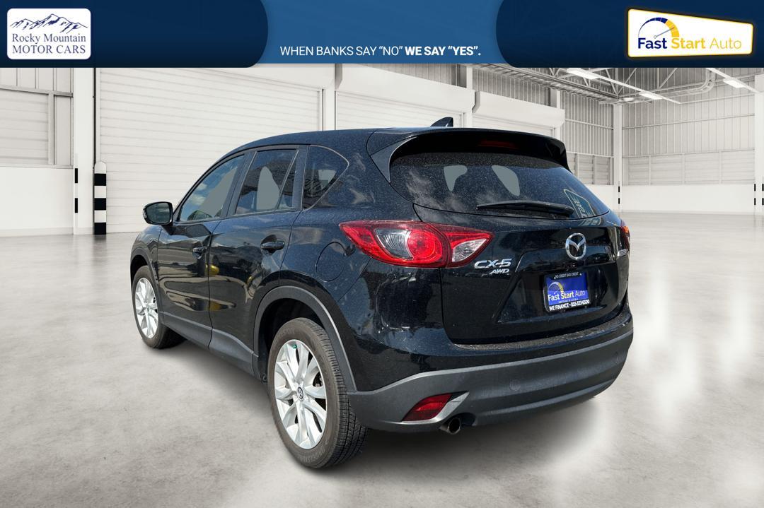 2014 Black Mazda CX-5 Grand Touring AWD (JM3KE4DY8E0) with an 2.5L L4 DOHC 16V engine, 6-Speed Automatic transmission, located at 7755 State Street, Midvale, UT, 84047, (801) 753-9063, 40.610329, -111.890656 - Photo #4