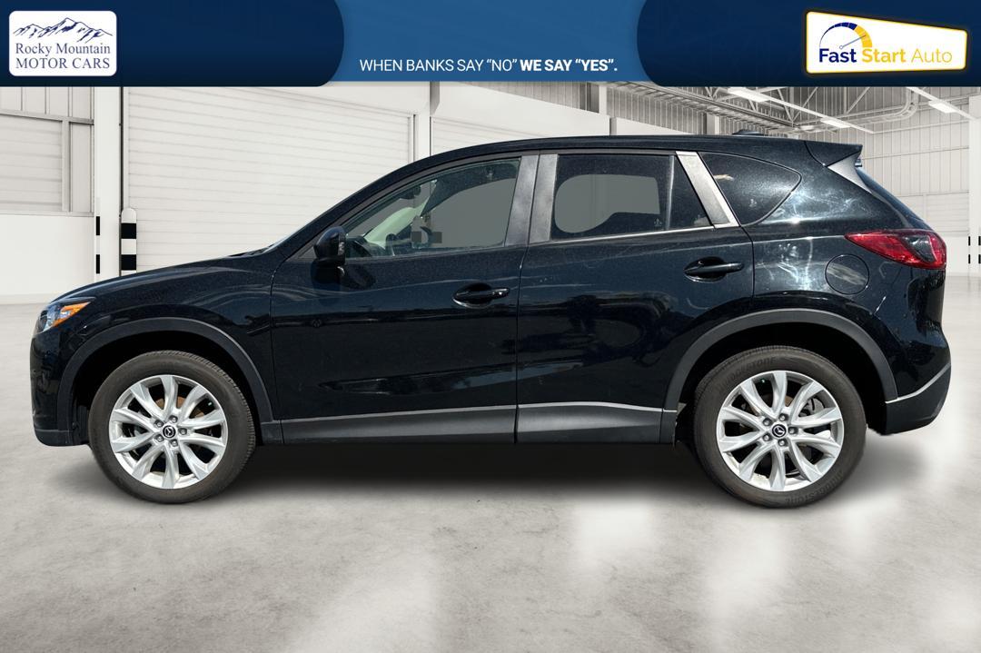 2014 Black Mazda CX-5 Grand Touring AWD (JM3KE4DY8E0) with an 2.5L L4 DOHC 16V engine, 6-Speed Automatic transmission, located at 7755 State Street, Midvale, UT, 84047, (801) 753-9063, 40.610329, -111.890656 - Photo #5