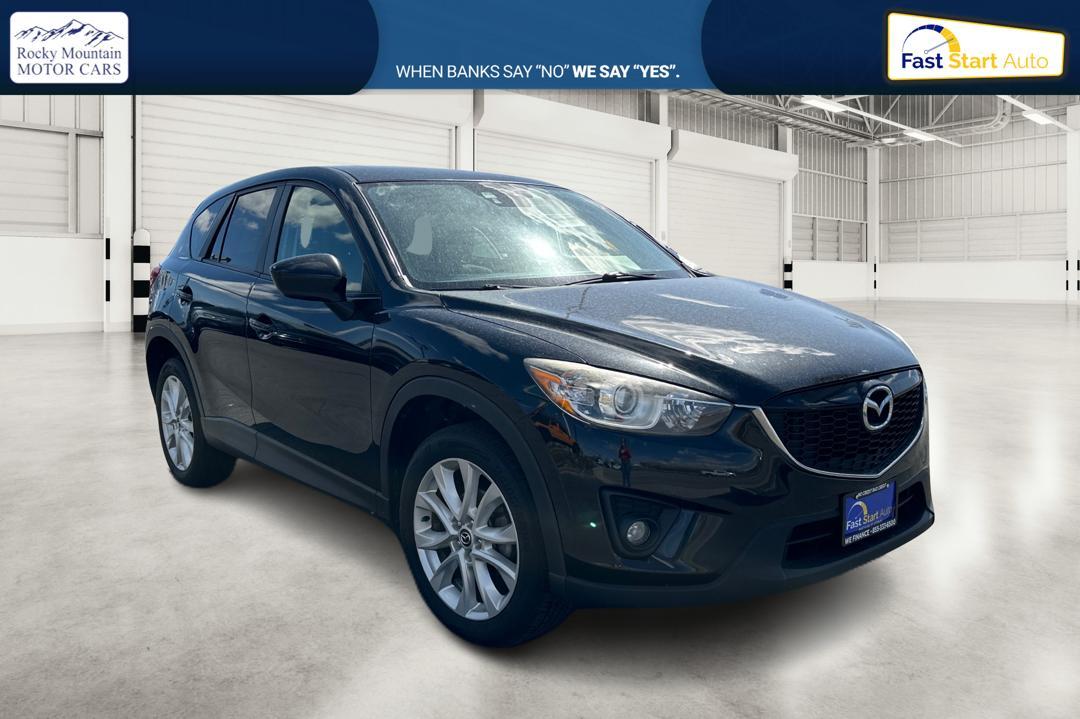 2014 Black Mazda CX-5 Grand Touring AWD (JM3KE4DY8E0) with an 2.5L L4 DOHC 16V engine, 6-Speed Automatic transmission, located at 7755 State Street, Midvale, UT, 84047, (801) 753-9063, 40.610329, -111.892159 - Photo #0