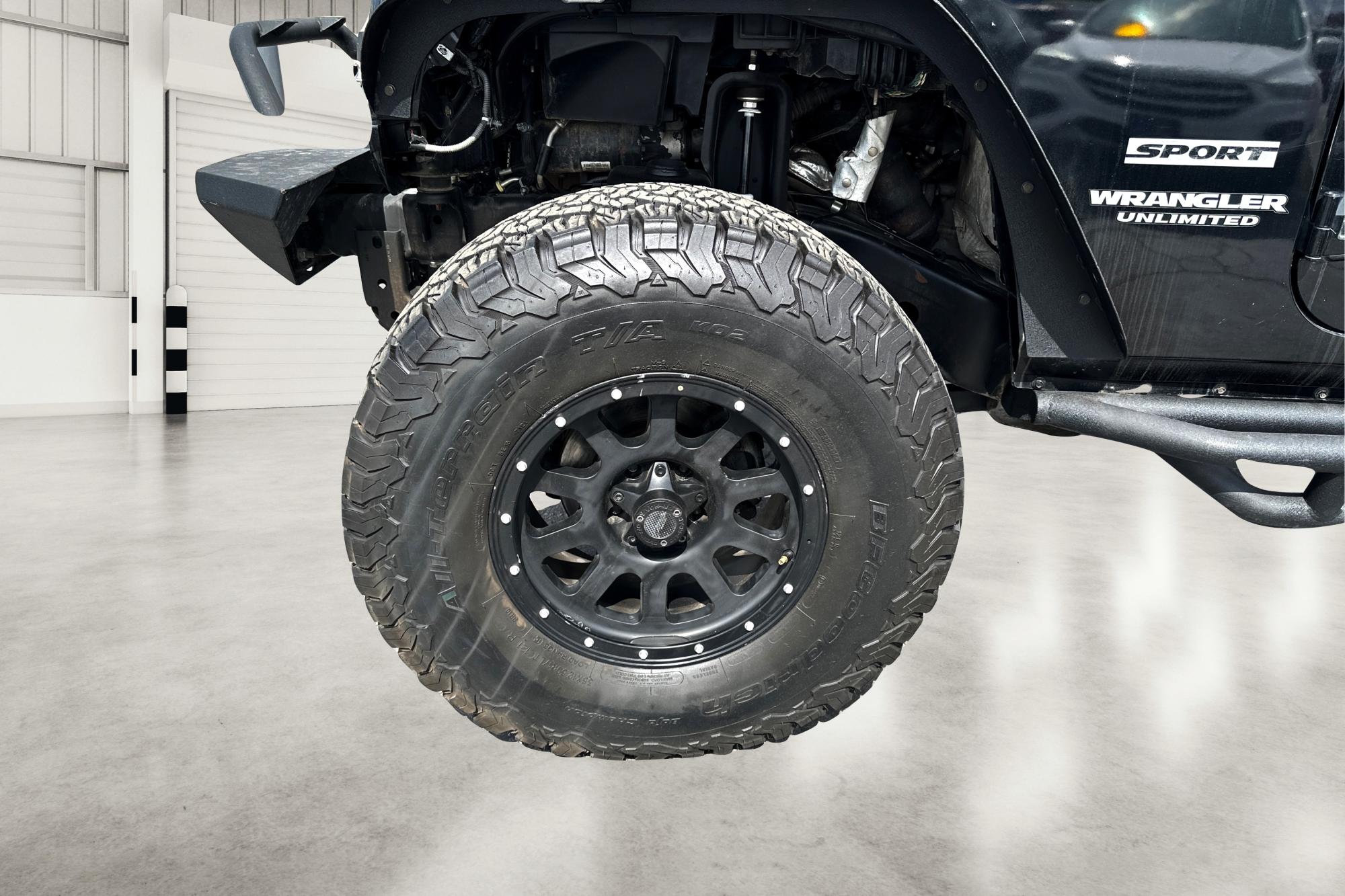 2013 Black Jeep Wrangler Unlimited Sport 4WD (1C4BJWDG7DL) with an 3.6L V6 DOHC 24V FFV engine, Automatic, 5-Spd transmission, located at 7755 State Street, Midvale, UT, 84047, (801) 753-9063, 40.610329, -111.892159 - Photo #9