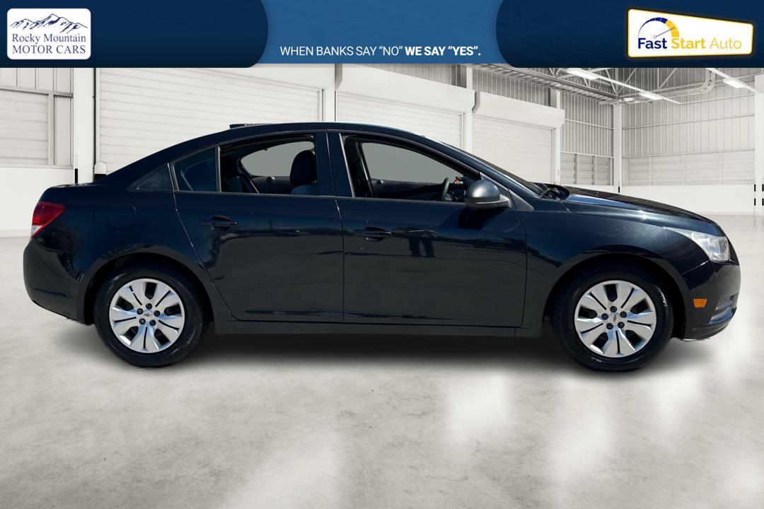 2013 Black Chevrolet Cruze LS Manual (1G1PB5SH3D7) with an 1.8L L4 DOHC 16V FFV engine, 6-Speed Manual transmission, located at 767 S State Road, Pleasant Grove, UT, 84062, (801) 785-1058, 40.354839, -111.736687 - Photo #1
