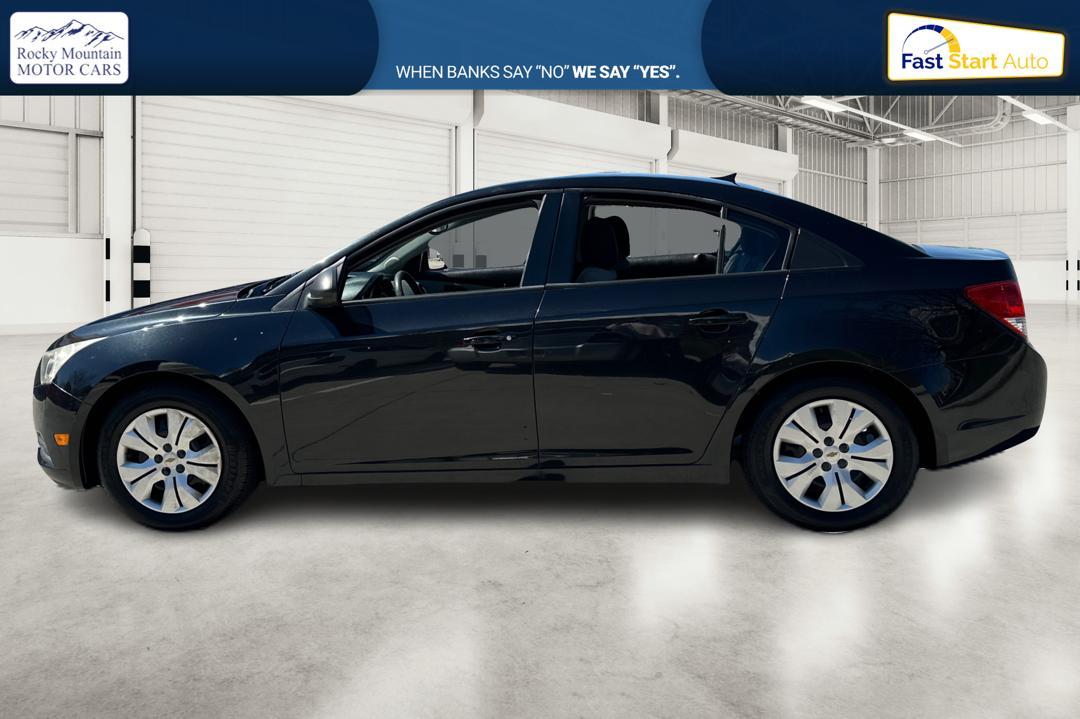 2013 Black Chevrolet Cruze LS Manual (1G1PB5SH3D7) with an 1.8L L4 DOHC 16V FFV engine, 6-Speed Manual transmission, located at 767 S State Road, Pleasant Grove, UT, 84062, (801) 785-1058, 40.354839, -111.736687 - Photo #5