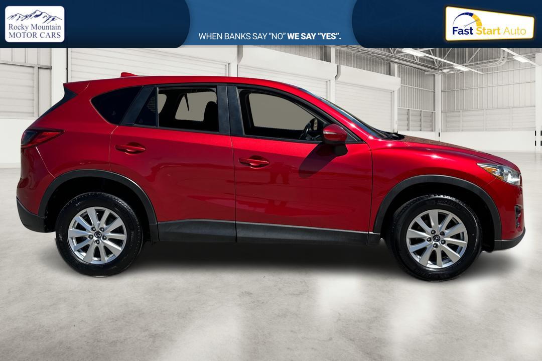 2016 Red Mazda CX-5 Touring (JM3KE2CY0G0) with an 2.5L L4 DOHC 16V engine, 6-Speed Automatic transmission, located at 767 S State Road, Pleasant Grove, UT, 84062, (801) 785-1058, 40.354839, -111.736687 - Photo #1