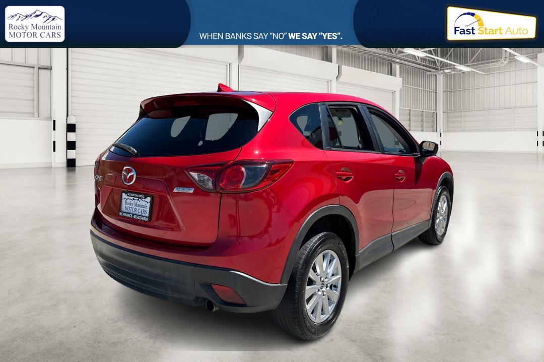 2016 Red Mazda CX-5 Touring (JM3KE2CY0G0) with an 2.5L L4 DOHC 16V engine, 6-Speed Automatic transmission, located at 767 S State Road, Pleasant Grove, UT, 84062, (801) 785-1058, 40.354839, -111.736687 - Photo #2