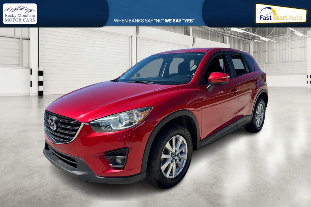 2016 Red Mazda CX-5 Touring (JM3KE2CY0G0) with an 2.5L L4 DOHC 16V engine, 6-Speed Automatic transmission, located at 767 S State Road, Pleasant Grove, UT, 84062, (801) 785-1058, 40.354839, -111.736687 - Photo #6