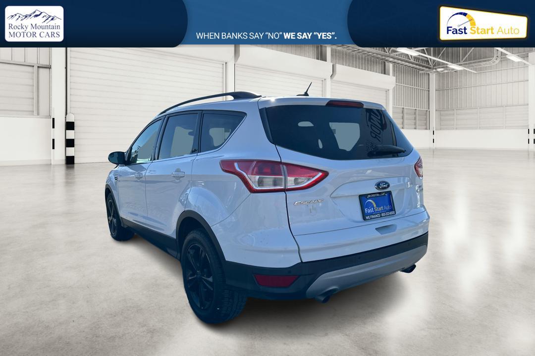 2016 White Ford Escape SE FWD (1FMCU0GX0GU) with an 1.6L L4 DOHC 16V engine, 6-Speed Automatic transmission, located at 344 S Washington Blvd, Ogden, UT, 84404, (801) 399-1799, 41.255482, -111.970848 - Photo #4