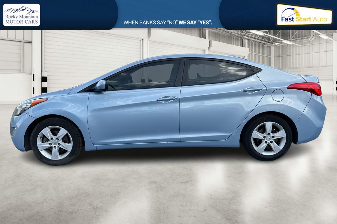2013 Blue Hyundai Elantra GLS A/T (KMHDH4AE2DU) with an 1.8L L4 DOHC 16V engine, 6-Speed Automatic transmission, located at 7755 State Street, Midvale, UT, 84047, (801) 753-9063, 40.610329, -111.892159 - Photo #5
