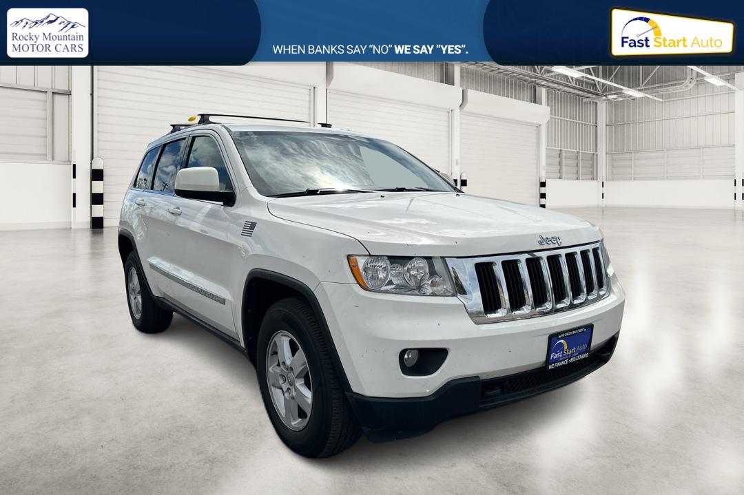 2012 White Jeep Grand Cherokee Laredo 4WD (1C4RJFAG7CC) with an 3.6L V6 DOHC 24V engine, 5-Speed Automatic transmission, located at 7755 State Street, Midvale, UT, 84047, (801) 753-9063, 40.610329, -111.892159 - Photo #0