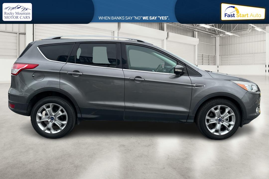 2014 Gray Ford Escape Titanium FWD (1FMCU0J97EU) with an 2.0L L4 DOHC 16V engine, 6-Speed Automatic transmission, located at 7755 State Street, Midvale, UT, 84047, (801) 753-9063, 40.610329, -111.890656 - Photo #1
