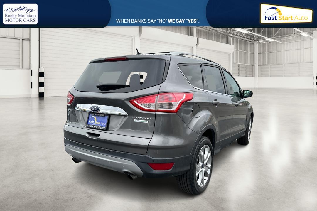 2014 Gray Ford Escape Titanium FWD (1FMCU0J97EU) with an 2.0L L4 DOHC 16V engine, 6-Speed Automatic transmission, located at 7755 State Street, Midvale, UT, 84047, (801) 753-9063, 40.610329, -111.890656 - Photo #2