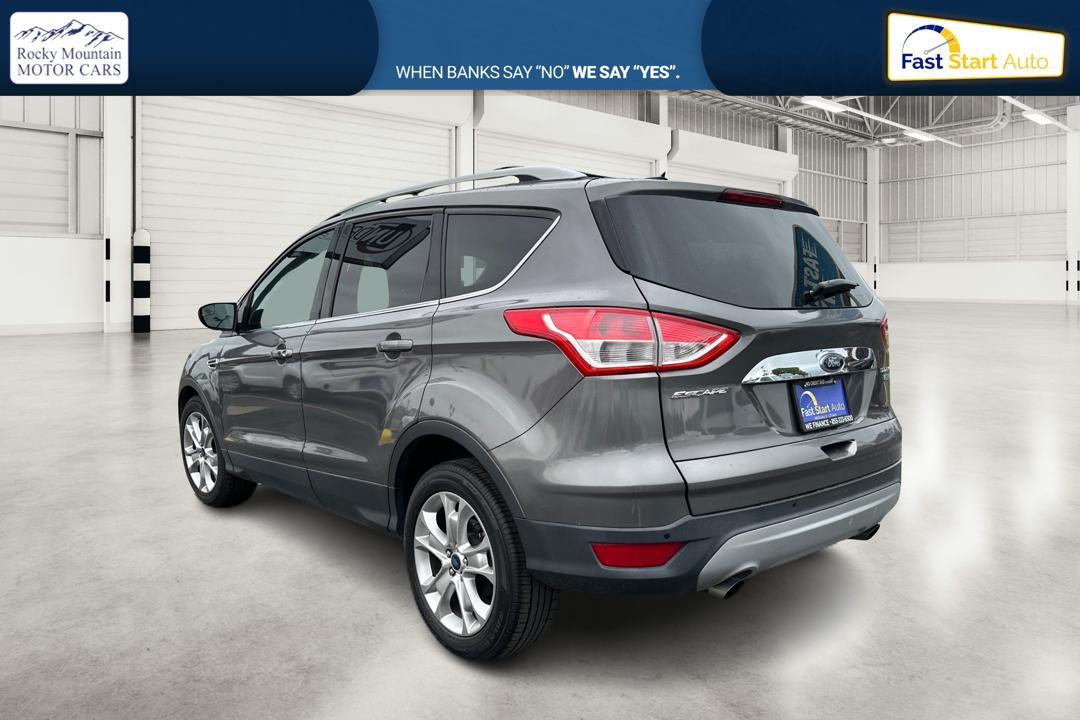 2014 Gray Ford Escape Titanium FWD (1FMCU0J97EU) with an 2.0L L4 DOHC 16V engine, 6-Speed Automatic transmission, located at 7755 State Street, Midvale, UT, 84047, (801) 753-9063, 40.610329, -111.890656 - Photo #4