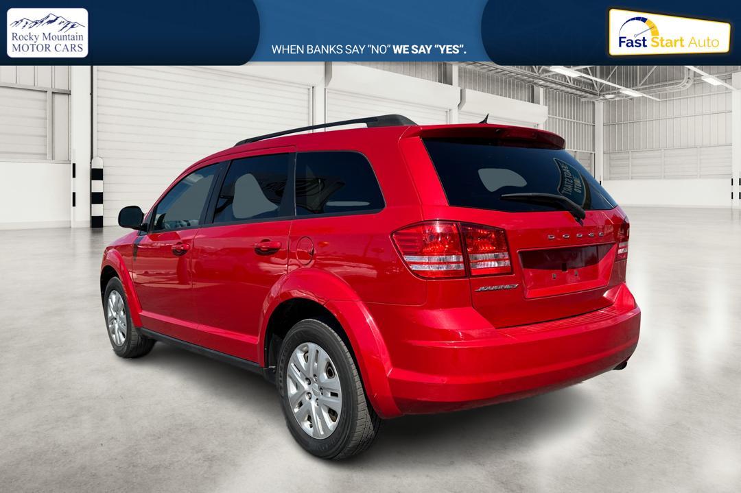 2016 Red Dodge Journey SE (3C4PDCABXGT) with an 2.4L L4 DOHC 16V engine, 4A transmission, located at 7755 State Street, Midvale, UT, 84047, (801) 753-9063, 40.610329, -111.890656 - Photo #4