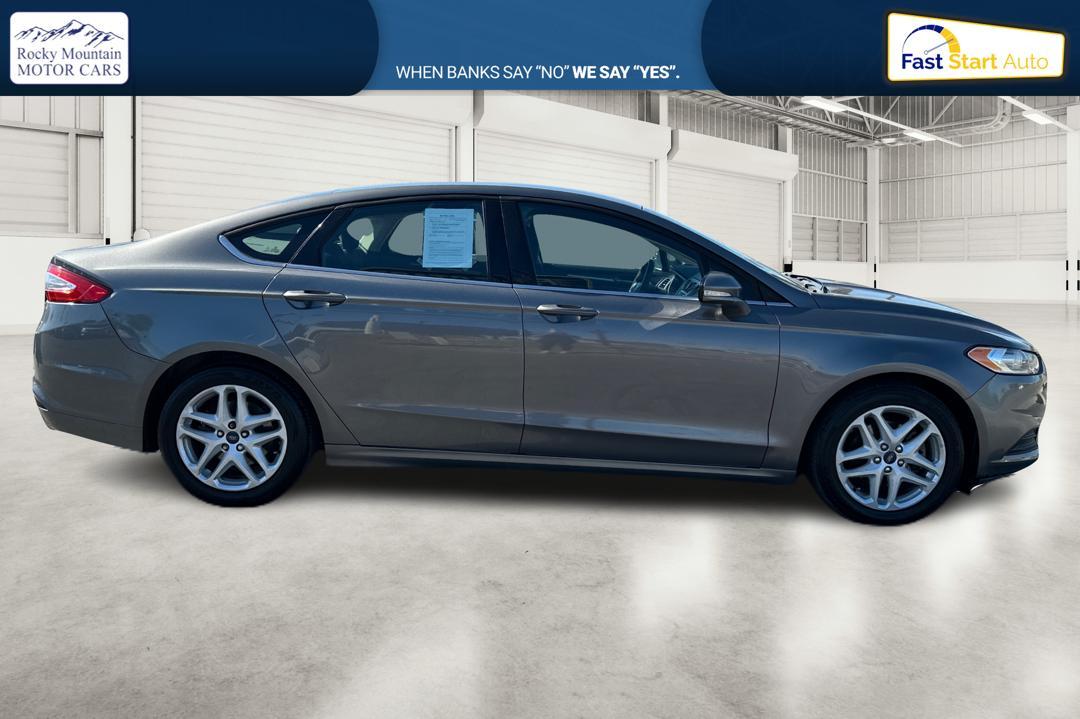 2014 Gray Ford Fusion SE (3FA6P0H74ER) with an 2.5L L4 DOHC 16V engine, Automatic, 6-Spd transmission, located at 767 S State Road, Pleasant Grove, UT, 84062, (801) 785-1058, 40.354839, -111.736687 - Photo #1