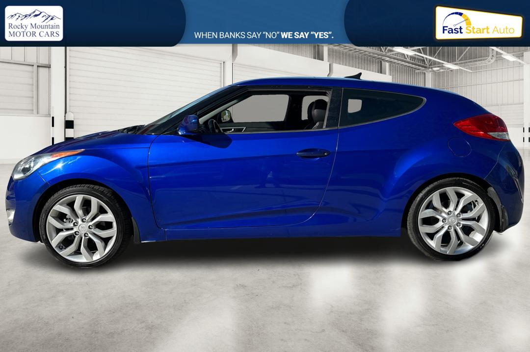 2013 Blue Hyundai Veloster Base (KMHTC6AD7DU) with an 1.6L L4 DOHC 16V engine, Auto, 6-Spd EcoShft DCT transmission, located at 767 S State Road, Pleasant Grove, UT, 84062, (801) 785-1058, 40.354839, -111.736687 - Photo#6