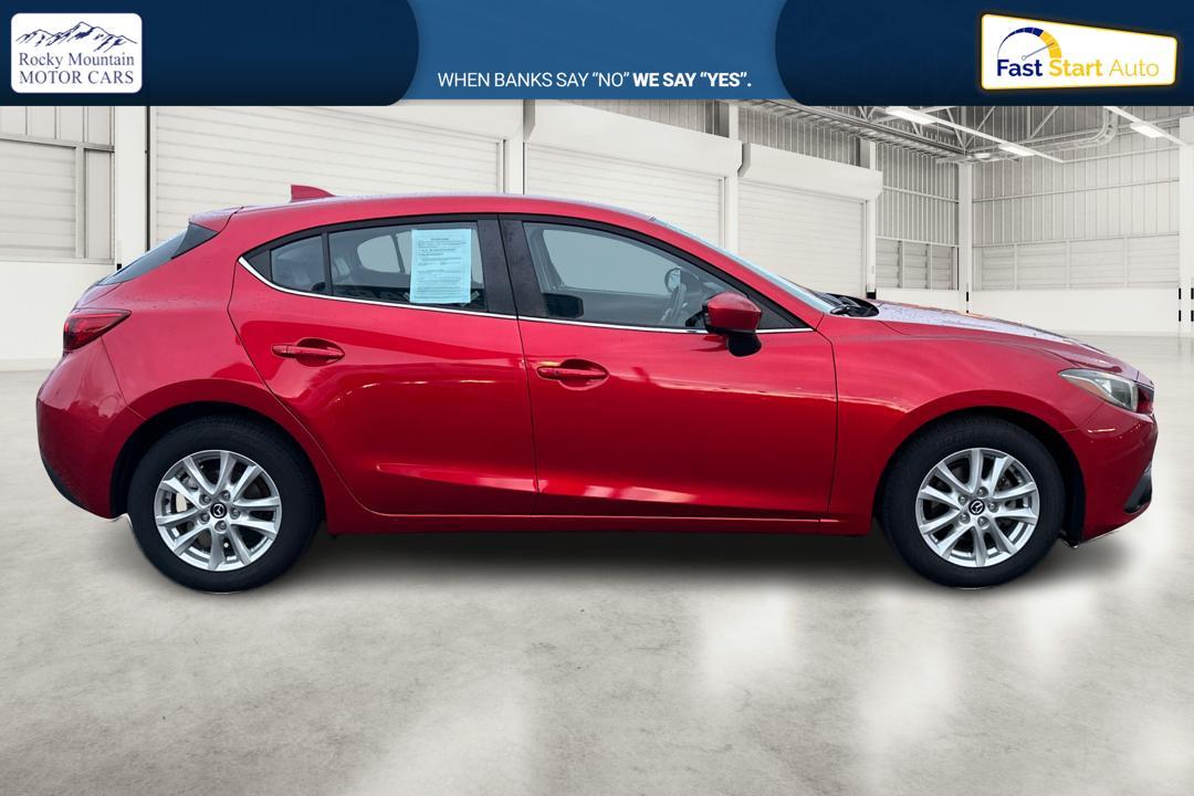 2015 Red Mazda MAZDA3 i Grand Touring AT 5-Door (JM1BM1M75F1) with an 2.0L L4 DOHC 16V engine, 6-Speed Automatic transmission, located at 7755 State Street, Midvale, UT, 84047, (801) 753-9063, 40.610329, -111.892159 - Photo#1