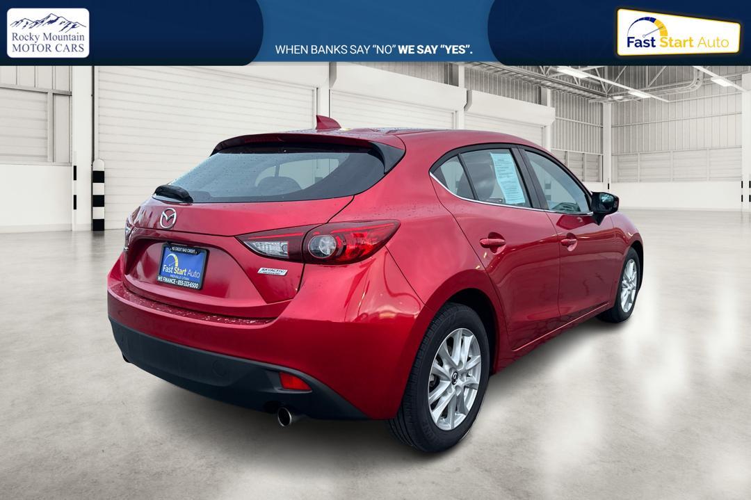 2015 Red Mazda MAZDA3 i Grand Touring AT 5-Door (JM1BM1M75F1) with an 2.0L L4 DOHC 16V engine, 6-Speed Automatic transmission, located at 7755 State Street, Midvale, UT, 84047, (801) 753-9063, 40.610329, -111.892159 - Photo#2