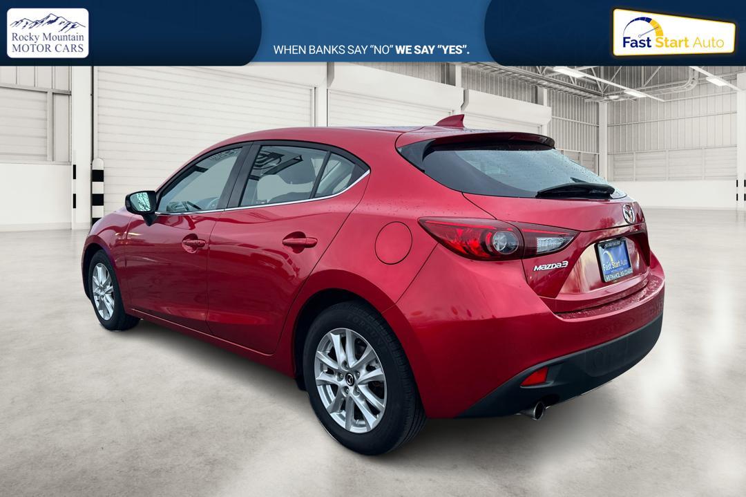 2015 Red Mazda MAZDA3 i Grand Touring AT 5-Door (JM1BM1M75F1) with an 2.0L L4 DOHC 16V engine, 6-Speed Automatic transmission, located at 7755 State Street, Midvale, UT, 84047, (801) 753-9063, 40.610329, -111.892159 - Photo#5