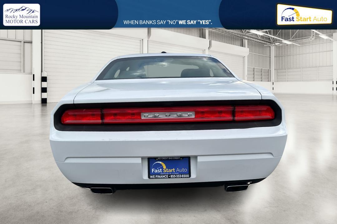 2012 White Dodge Challenger SXT (2C3CDYAG7CH) with an 3.6L V6 DOHC 24V engine, 4-Speed Automatic transmission, located at 7755 State Street, Midvale, UT, 84047, (801) 753-9063, 40.610329, -111.890656 - Photo#4