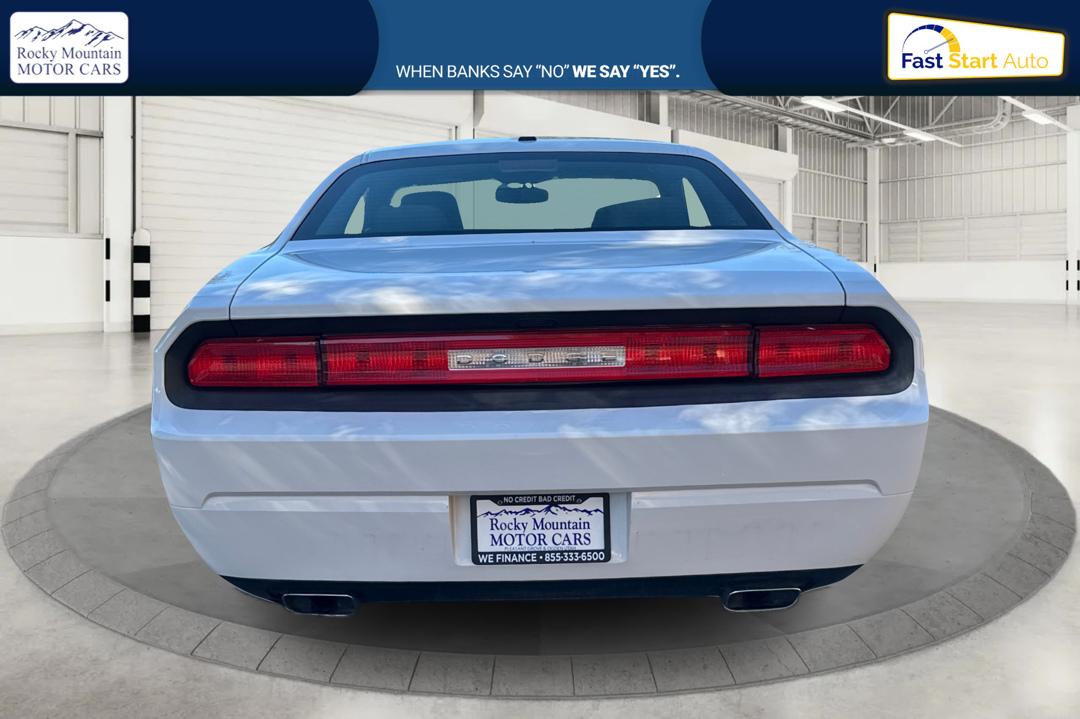 2012 White Dodge Challenger SXT (2C3CDYAG7CH) with an 3.6L V6 DOHC 24V engine, 4-Speed Automatic transmission, located at 767 S State Road, Pleasant Grove, UT, 84062, (801) 785-1058, 40.354839, -111.736687 - Photo#3