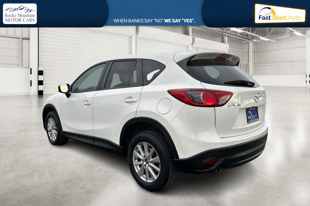 2016 White Mazda CX-5 Touring (JM3KE2CY5G0) with an 2.5L L4 DOHC 16V engine, 6-Speed Automatic transmission, located at 767 S State Road, Pleasant Grove, UT, 84062, (801) 785-1058, 40.354839, -111.736687 - Photo#5