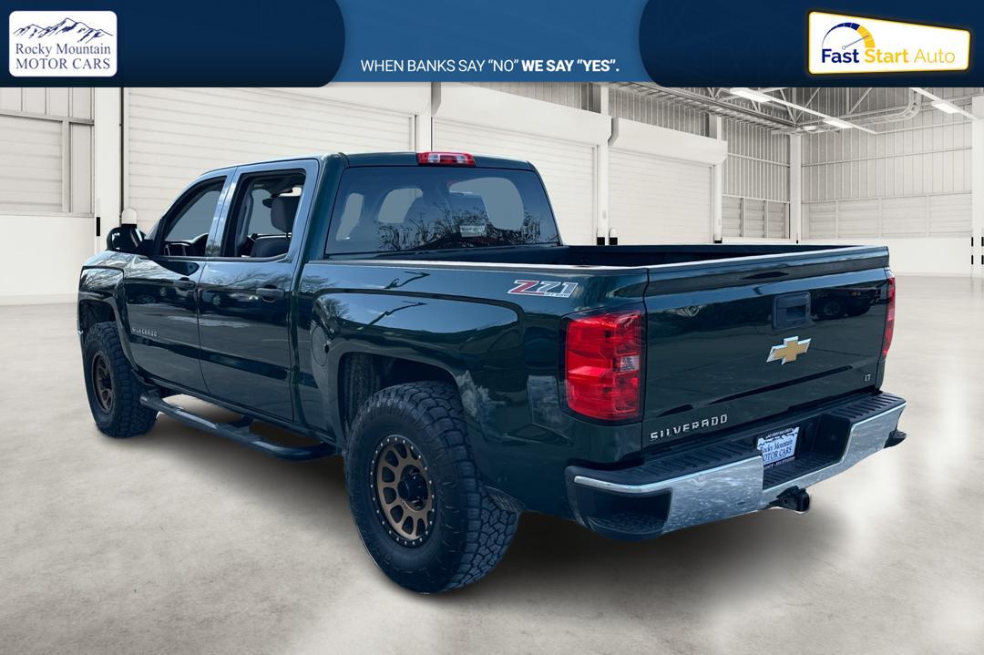 2014 Green Chevrolet Silverado 1500 1LT Crew Cab 4WD (3GCUKREC0EG) with an 5.3L V8 OHV 16V engine, 6-Speed Automatic transmission, located at 767 S State Road, Pleasant Grove, UT, 84062, (801) 785-1058, 40.354839, -111.736687 - Photo#5