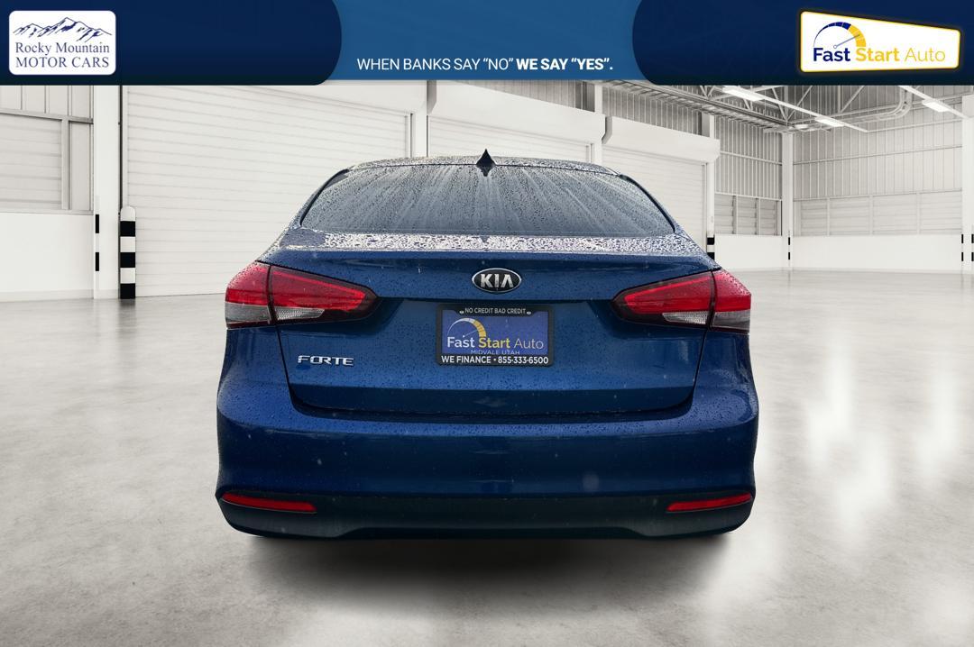 2018 Blue Kia Forte LX 6M (3KPFK4A77JE) with an 2.0L L4 DOHC 16V engine, 6M transmission, located at 7755 State Street, Midvale, UT, 84047, (801) 753-9063, 40.610329, -111.892159 - Photo#4