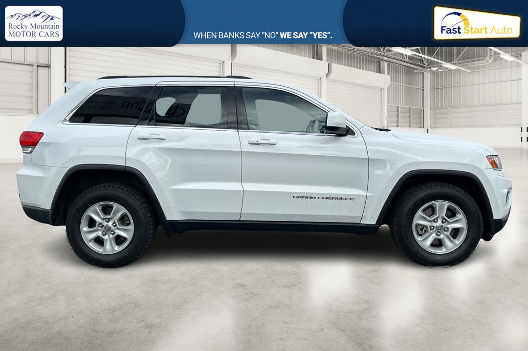 2014 White Jeep Grand Cherokee Laredo 4WD (1C4RJFAG2EC) with an 3.6L V6 DOHC 24V engine, 5-Speed Automatic transmission, located at 7755 State Street, Midvale, UT, 84047, (801) 753-9063, 40.610329, -111.892159 - Photo#1