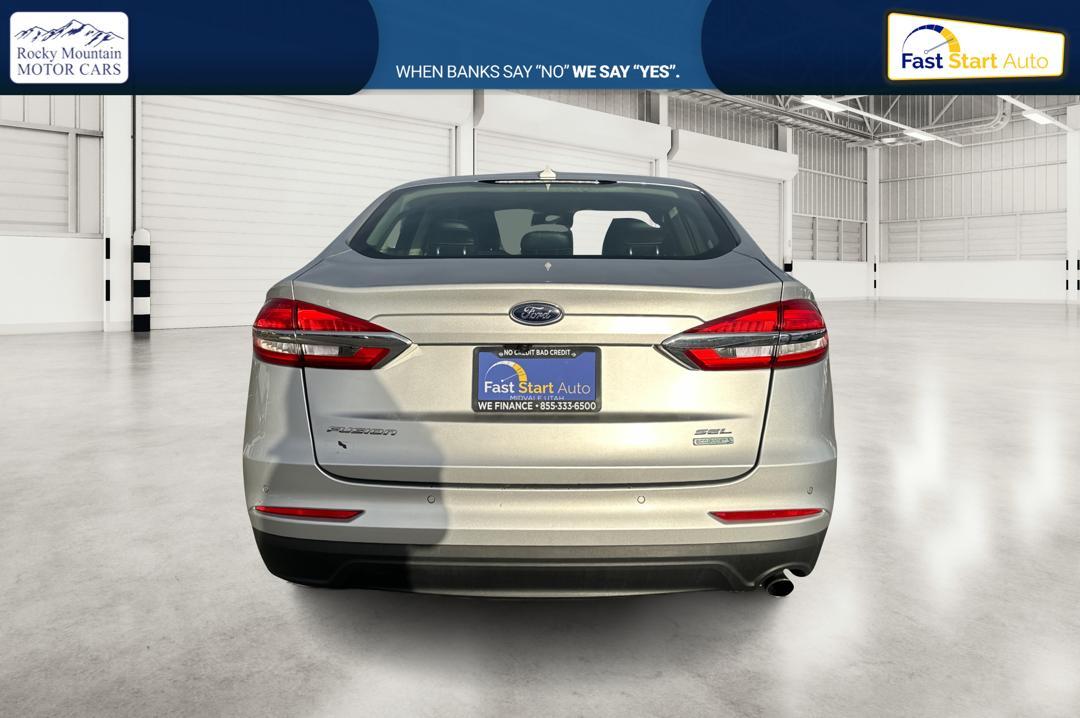 2019 Silver Ford Fusion SEL (3FA6P0CD1KR) with an 1.5L L4 DOHC 16V engine, 6A transmission, located at 7755 State Street, Midvale, UT, 84047, (801) 753-9063, 40.610329, -111.892159 - Photo#4