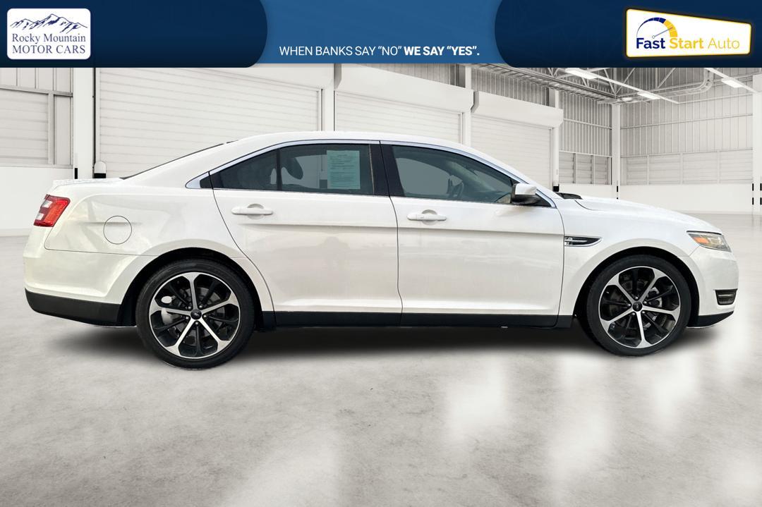 2015 White Ford Taurus SEL FWD (1FAHP2E87FG) with an 3.5L V6 DOHC 24V engine, 6-Speed Automatic transmission, located at 7755 State Street, Midvale, UT, 84047, (801) 753-9063, 40.610329, -111.892159 - Photo#1