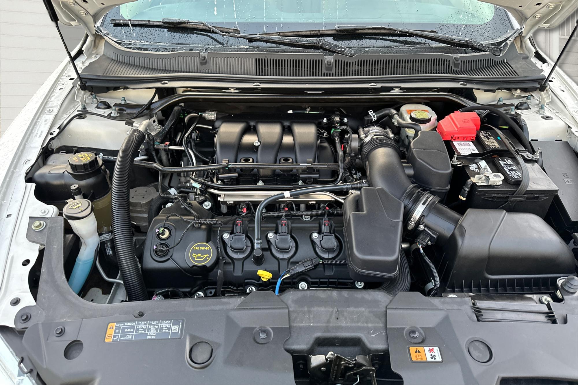 2015 White Ford Taurus SEL FWD (1FAHP2E87FG) with an 3.5L V6 DOHC 24V engine, 6-Speed Automatic transmission, located at 7755 State Street, Midvale, UT, 84047, (801) 753-9063, 40.610329, -111.892159 - Photo#10