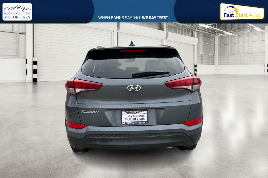 2018 Gray Hyundai Tucson SE (KM8J33A48JU) with an 2.0L L4 DOHC 16V engine, 6A transmission, located at 344 S Washington Blvd, Ogden, UT, 84404, (801) 399-1799, 41.255482, -111.970848 - Photo#4