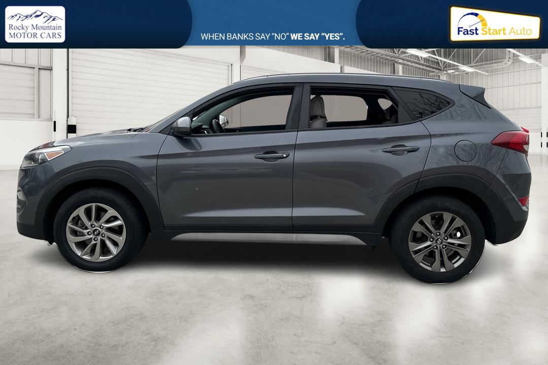 2018 Gray Hyundai Tucson SE (KM8J33A48JU) with an 2.0L L4 DOHC 16V engine, 6A transmission, located at 344 S Washington Blvd, Ogden, UT, 84404, (801) 399-1799, 41.255482, -111.970848 - Photo#6