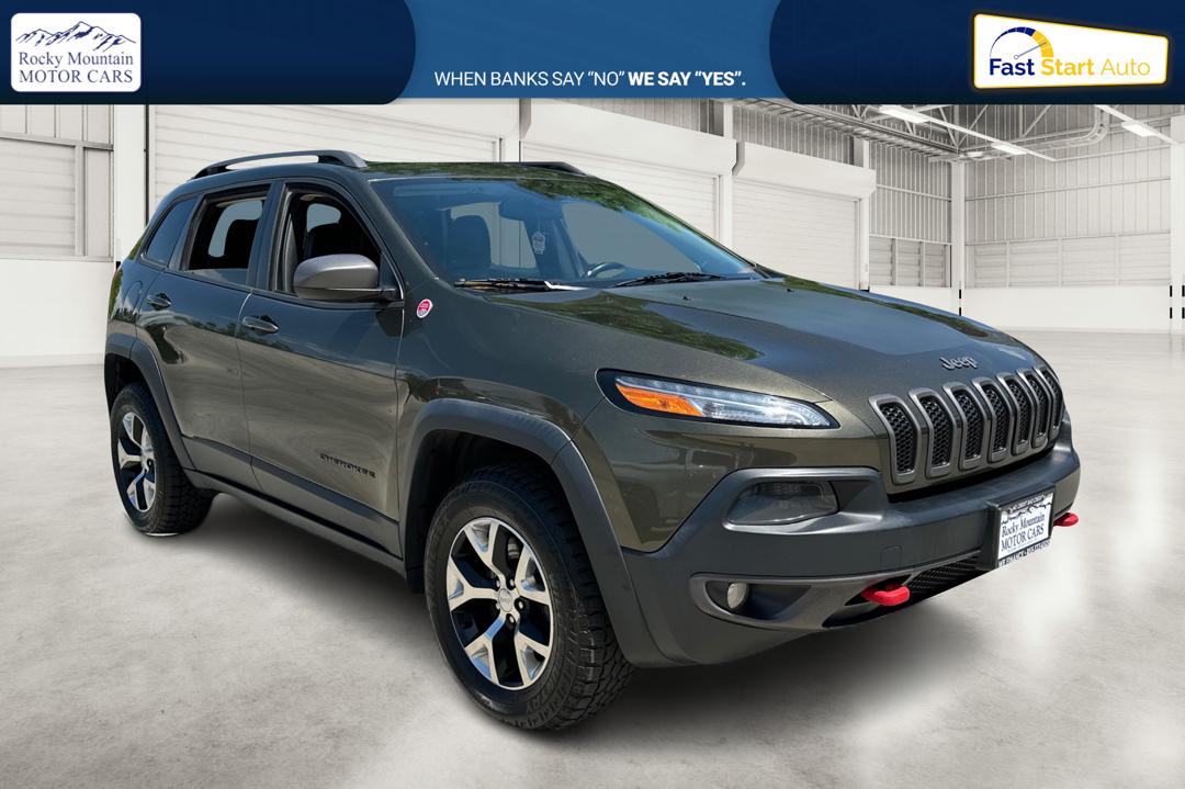 2015 Green Jeep Cherokee Trailhawk 4WD (1C4PJMBSXFW) with an 3.2L V6 DOHC 24V engine, 9-Speed Automatic transmission, located at 767 S State Road, Pleasant Grove, UT, 84062, (801) 785-1058, 40.354839, -111.736687 - Photo#0