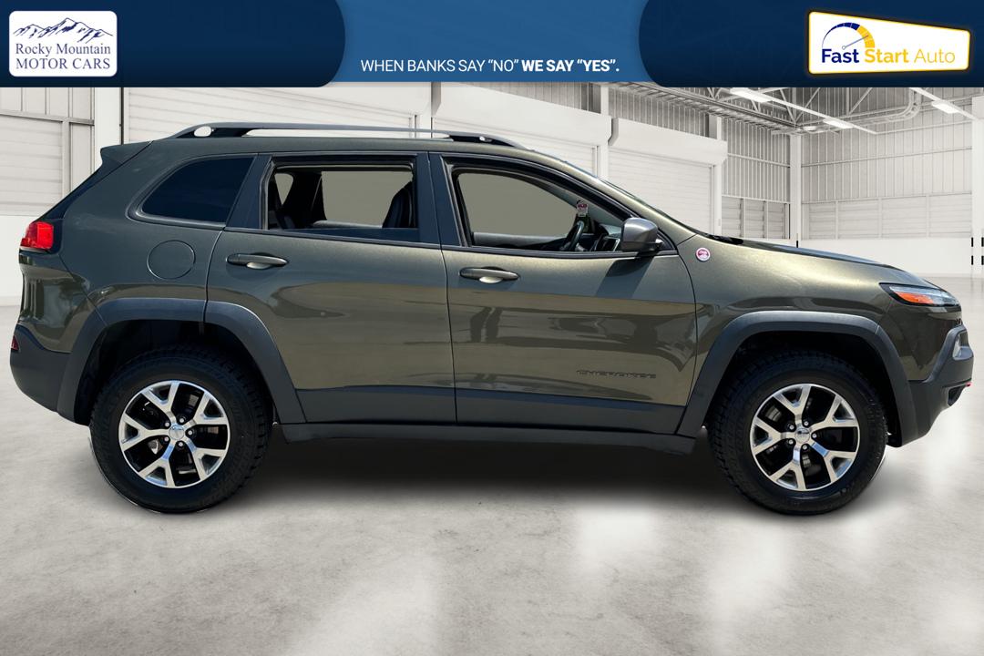 2015 Green Jeep Cherokee Trailhawk 4WD (1C4PJMBSXFW) with an 3.2L V6 DOHC 24V engine, 9-Speed Automatic transmission, located at 767 S State Road, Pleasant Grove, UT, 84062, (801) 785-1058, 40.354839, -111.736687 - Photo#1