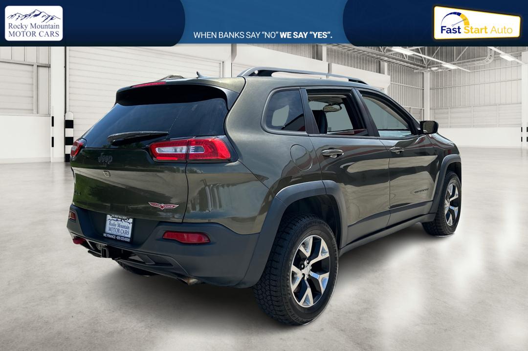 2015 Green Jeep Cherokee Trailhawk 4WD (1C4PJMBSXFW) with an 3.2L V6 DOHC 24V engine, 9-Speed Automatic transmission, located at 767 S State Road, Pleasant Grove, UT, 84062, (801) 785-1058, 40.354839, -111.736687 - Photo#2