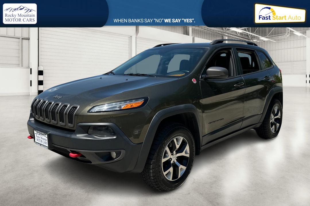 2015 Green Jeep Cherokee Trailhawk 4WD (1C4PJMBSXFW) with an 3.2L V6 DOHC 24V engine, 9-Speed Automatic transmission, located at 767 S State Road, Pleasant Grove, UT, 84062, (801) 785-1058, 40.354839, -111.736687 - Photo#8
